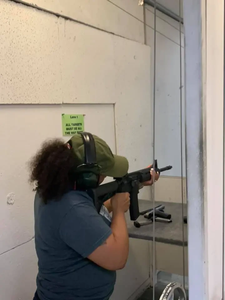 Firearms instructor coaching a student