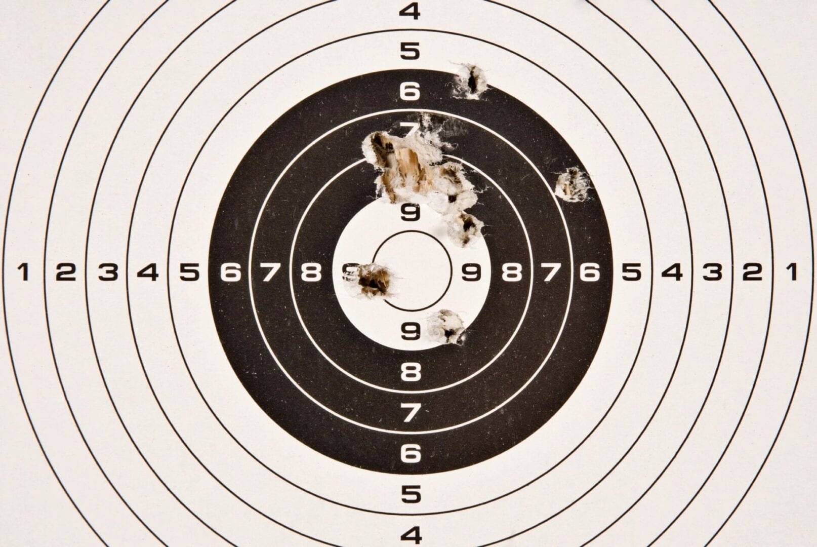 A close up of a target with bullet holes